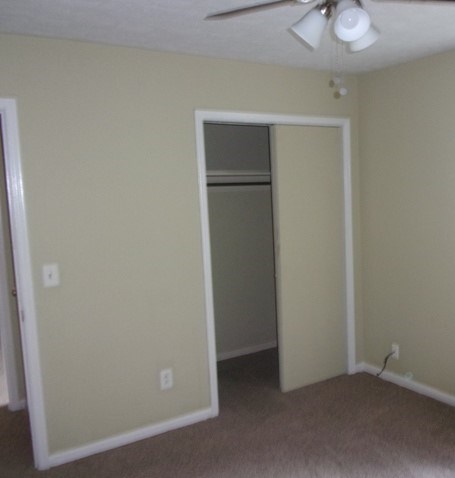 6312 Moon Road Columbus, GA 31909 - Photo 11 of 12 an empty room with closet and a chandelier fan