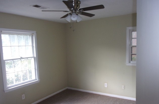 6312 Moon Road Columbus, GA 31909 - Photo 10 of 12 an empty room with a window and a fan
