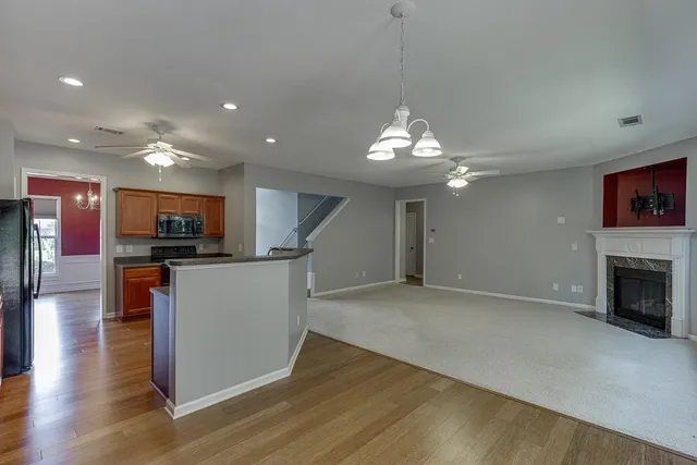 a view of a kitchen with microwave and cabinets