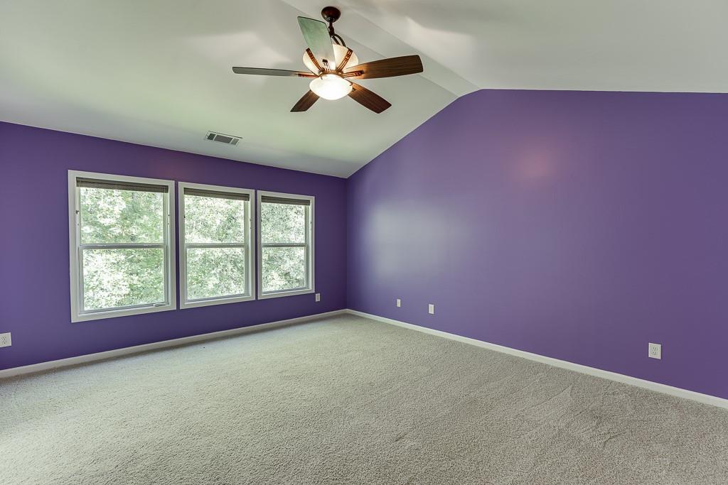 2365 Valley Mill Drive Buford, GA 30519 - Photo 26 of 53 an empty room with a window and a ceiling fan