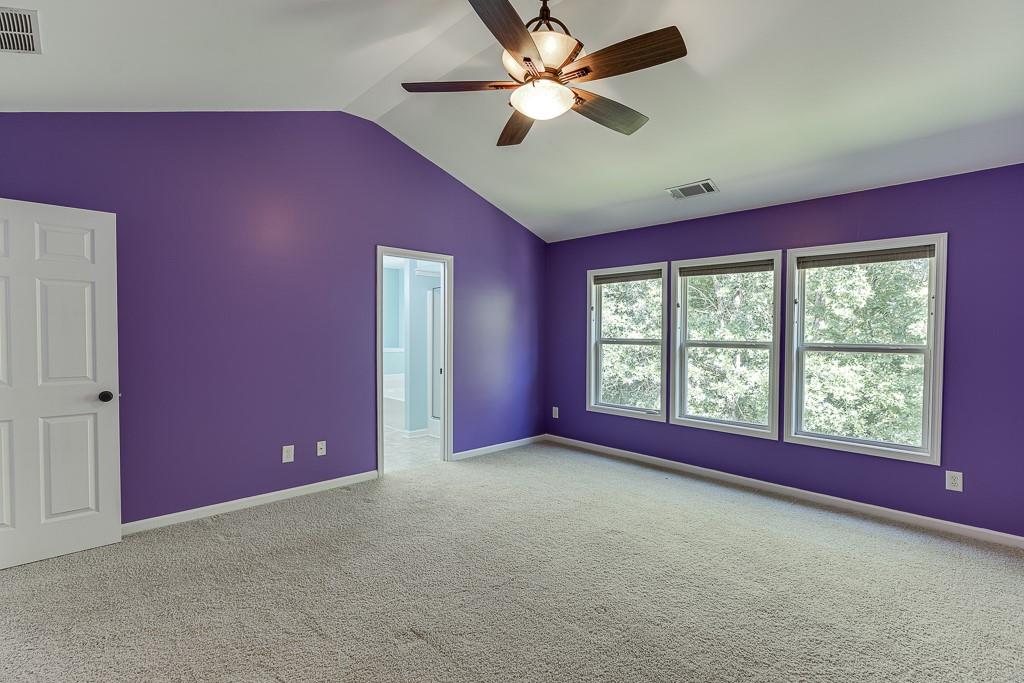 2365 Valley Mill Drive Buford, GA 30519 - Photo 28 of 53 a big room with windows and a ceiling fan