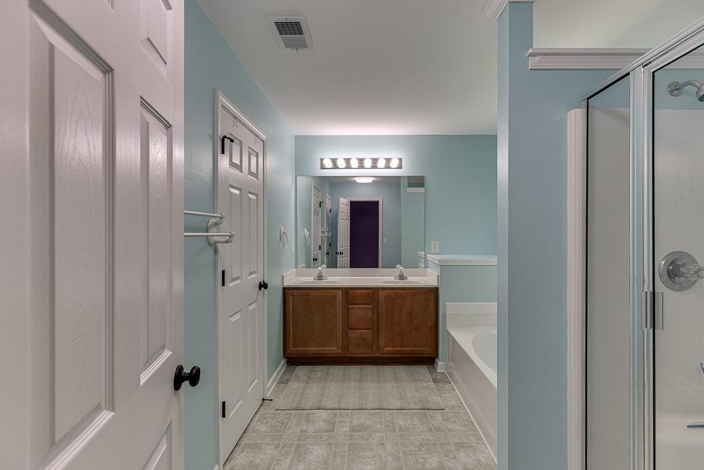 2365 Valley Mill Drive Buford, GA 30519 - Photo 29 of 53 a view of a hallway with windows and chandelier