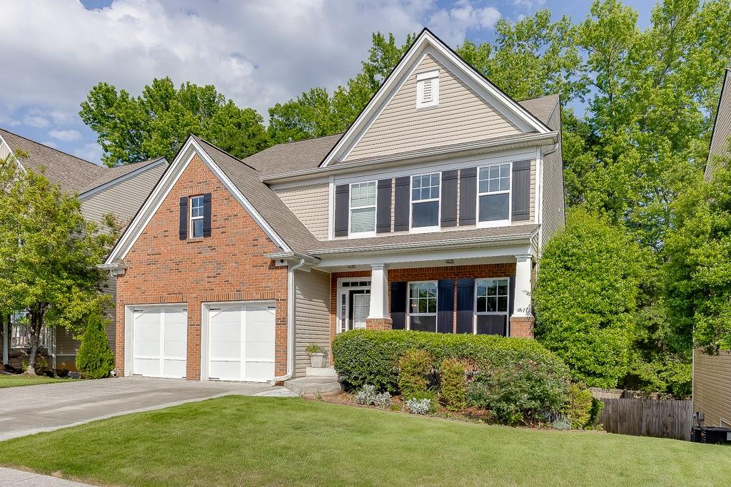 2365 Valley Mill Drive Buford, GA 30519 - Photo 3 of 53 a front view of a house with a yard