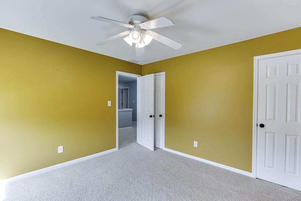 2365 Valley Mill Drive Buford, GA 30519 - Photo 35 of 53 a view of an empty room with a chandelier fan
