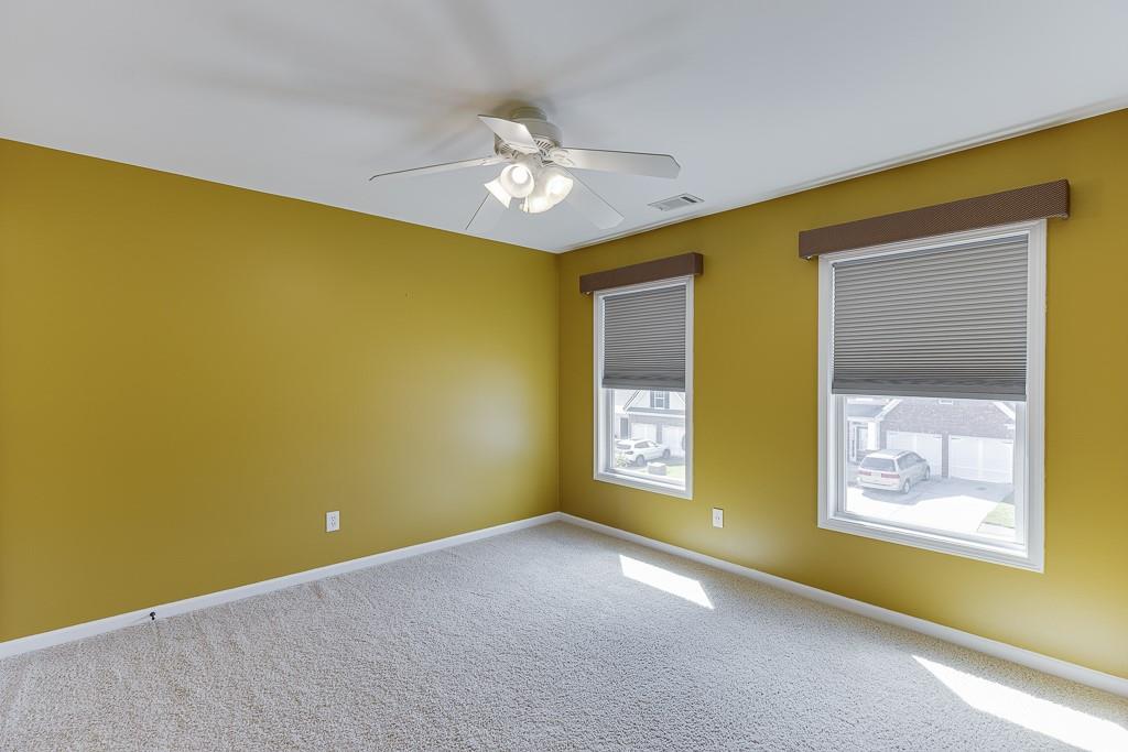 2365 Valley Mill Drive Buford, GA 30519 - Photo 36 of 53 a view of a big room with windows and chandelier fan