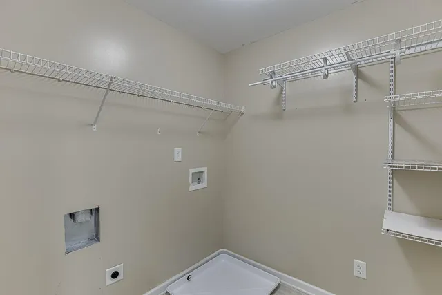 a room with pool table and wooden floor