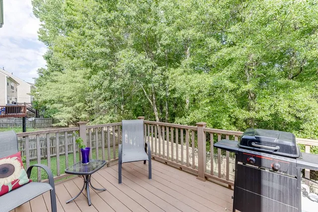 a view of a house with a yard and sitting area