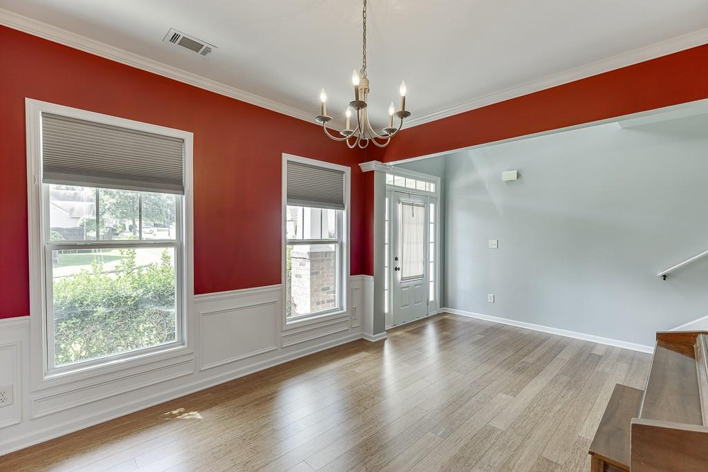 2365 Valley Mill Drive Buford, GA 30519 - Photo 7 of 53 a view of a livingroom with a window and wooden floor