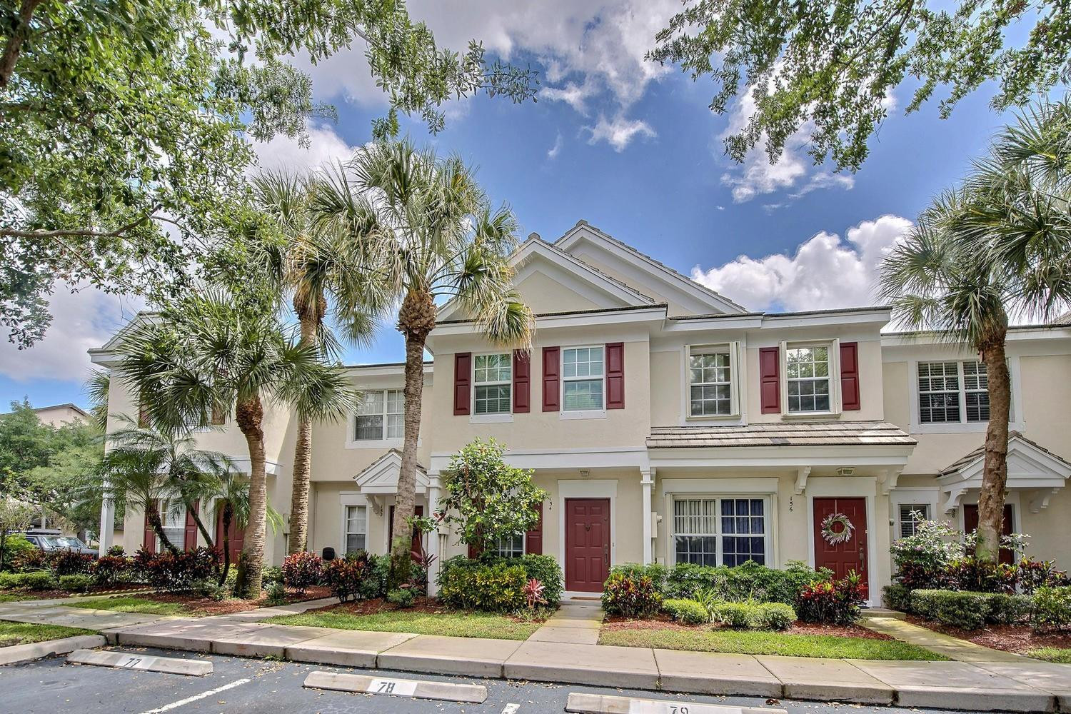 154 Southwest 96th Terrace Plantation, FL 33324 - Photo 2 of 10 a front view of a house with a garden