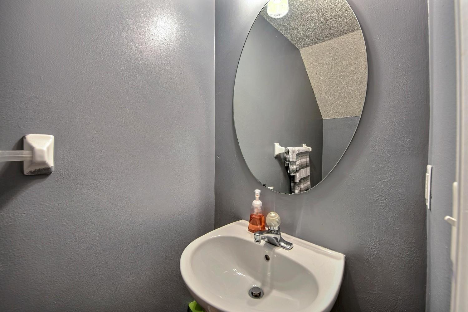 154 Southwest 96th Terrace Plantation, FL 33324 - Photo 7 of 10 a bathroom with a sink and mirror