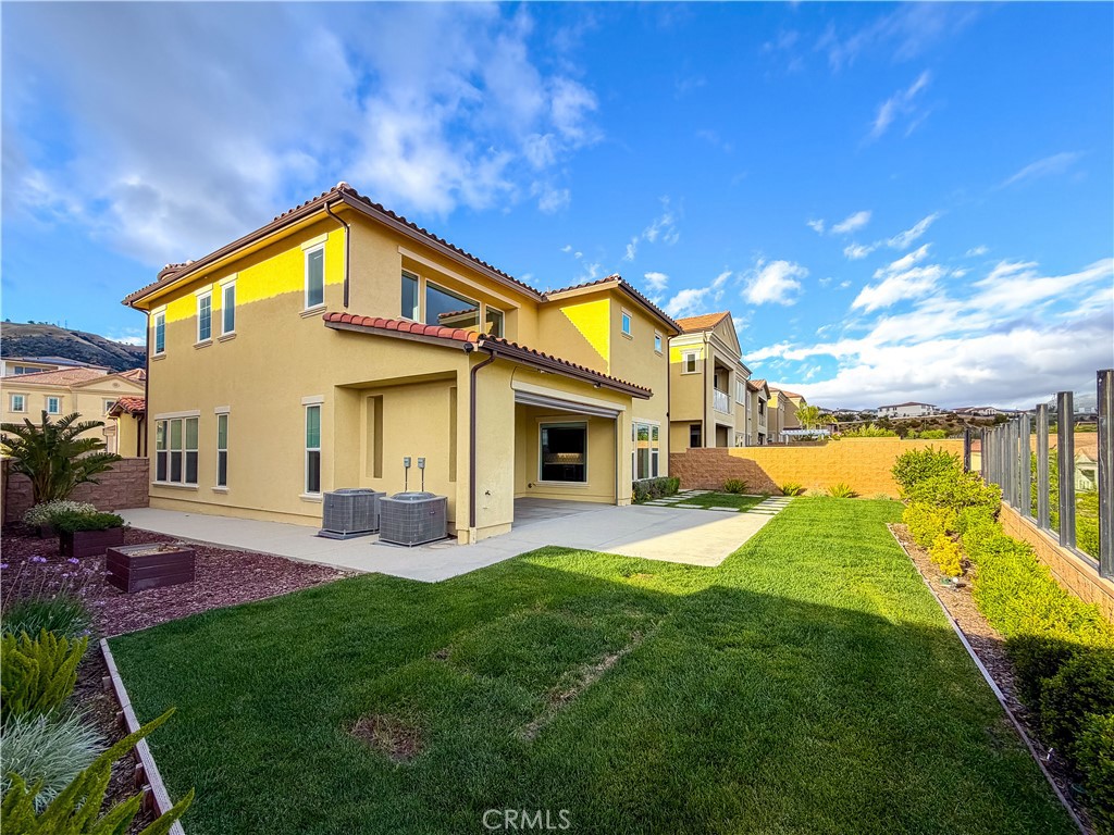20626 Deer Grass Court Porter Ranch, CA 91326 - Photo 4 of 45 a view of a house with a swimming pool