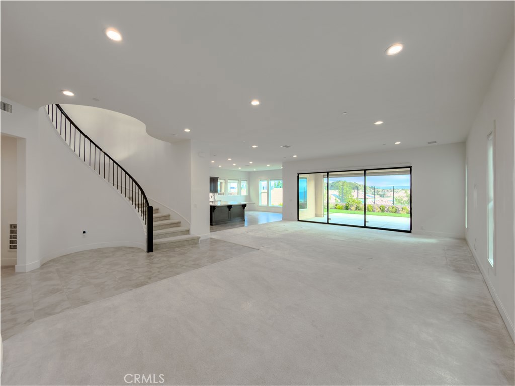 20626 Deer Grass Court Porter Ranch, CA 91326 - Photo 43 of 45 a view of an empty room with a window and fireplace