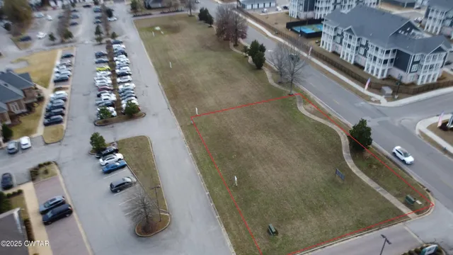 an aerial view of houses with outdoor space