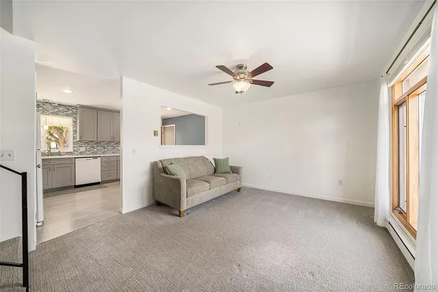a living room with furniture and windows