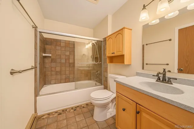 a bathroom with a sink a toilet and a bathtub