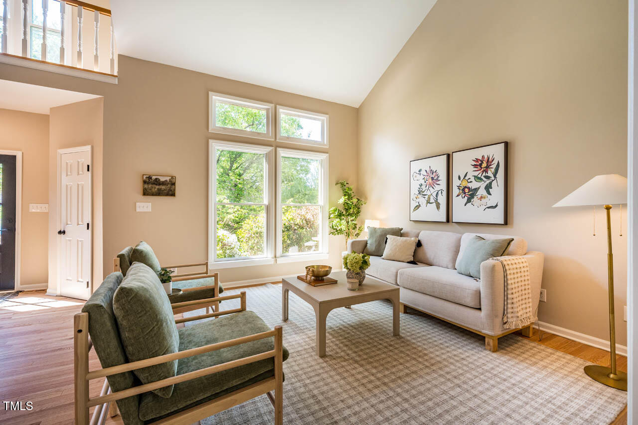 103 Windhover Drive Chapel Hill, NC 27514 - Photo 10 of 61 a living room with furniture and a large window