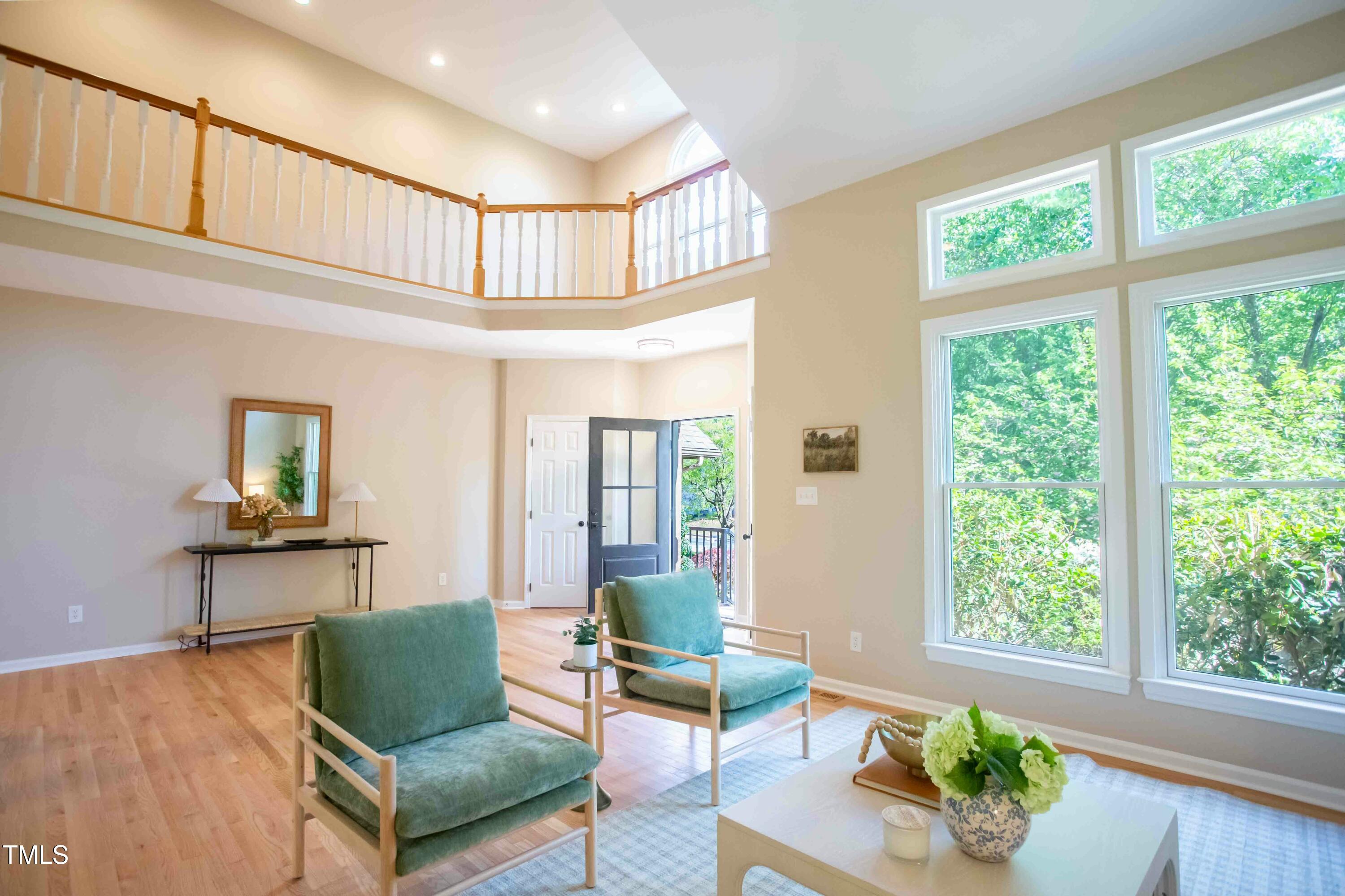 103 Windhover Drive Chapel Hill, NC 27514 - Photo 11 of 61 a living room with furniture and a large window