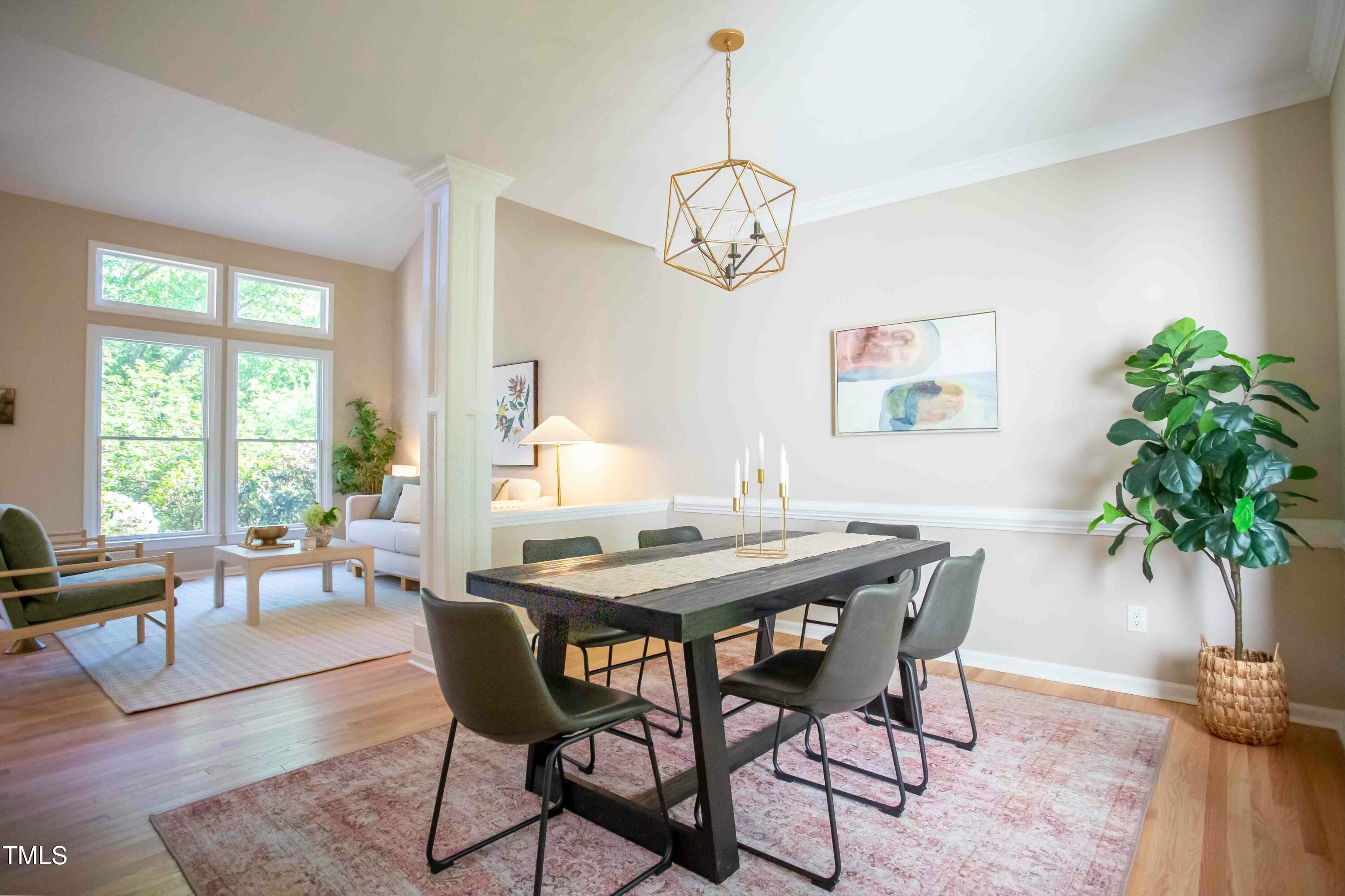 103 Windhover Drive Chapel Hill, NC 27514 - Photo 15 of 61 a view of a dining room with furniture window and wooden floor