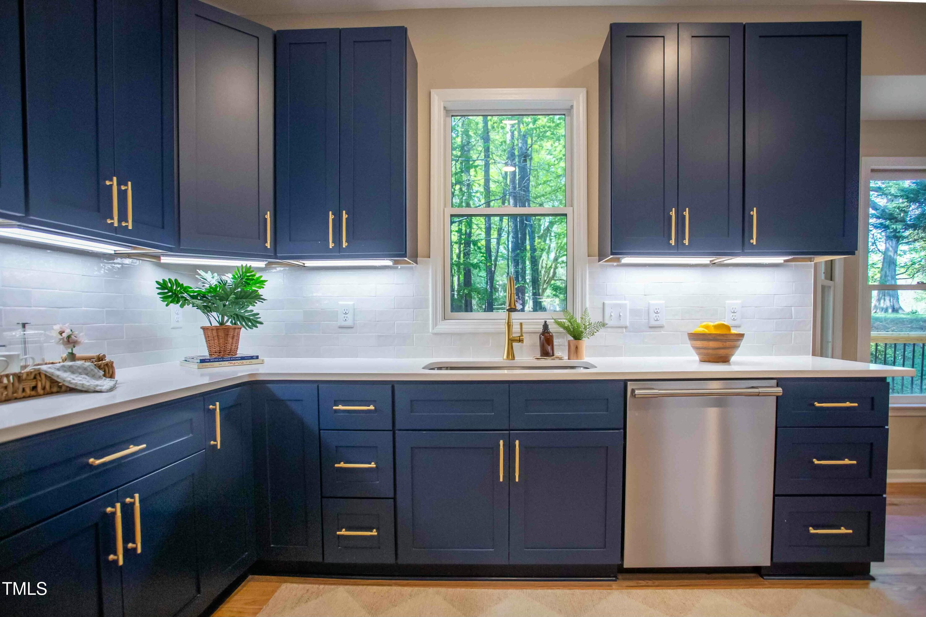 103 Windhover Drive Chapel Hill, NC 27514 - Photo 21 of 61 a kitchen with stainless steel appliances granite countertop wooden cabinets a sink and dishwasher