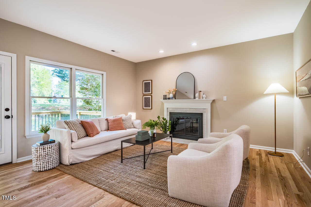103 Windhover Drive Chapel Hill, NC 27514 - Photo 24 of 61 a living room with furniture and a fireplace