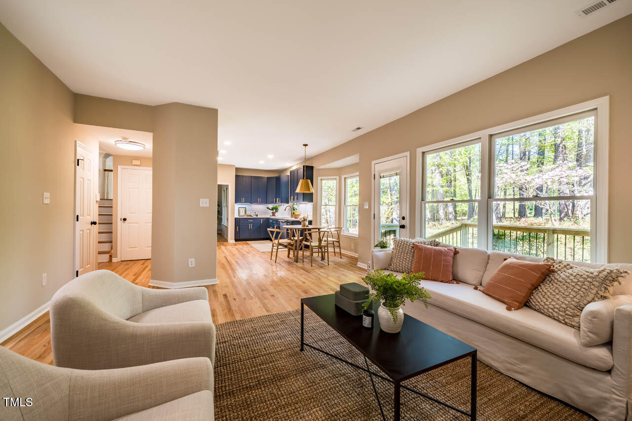 103 Windhover Drive Chapel Hill, NC 27514 - Photo 26 of 61 a living room with furniture and a large window