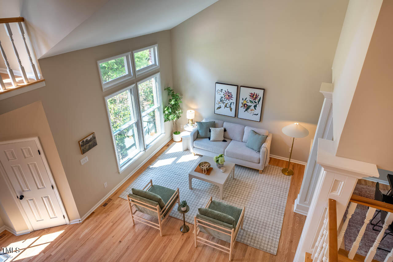 103 Windhover Drive Chapel Hill, NC 27514 - Photo 32 of 61 a living room with furniture and a large window