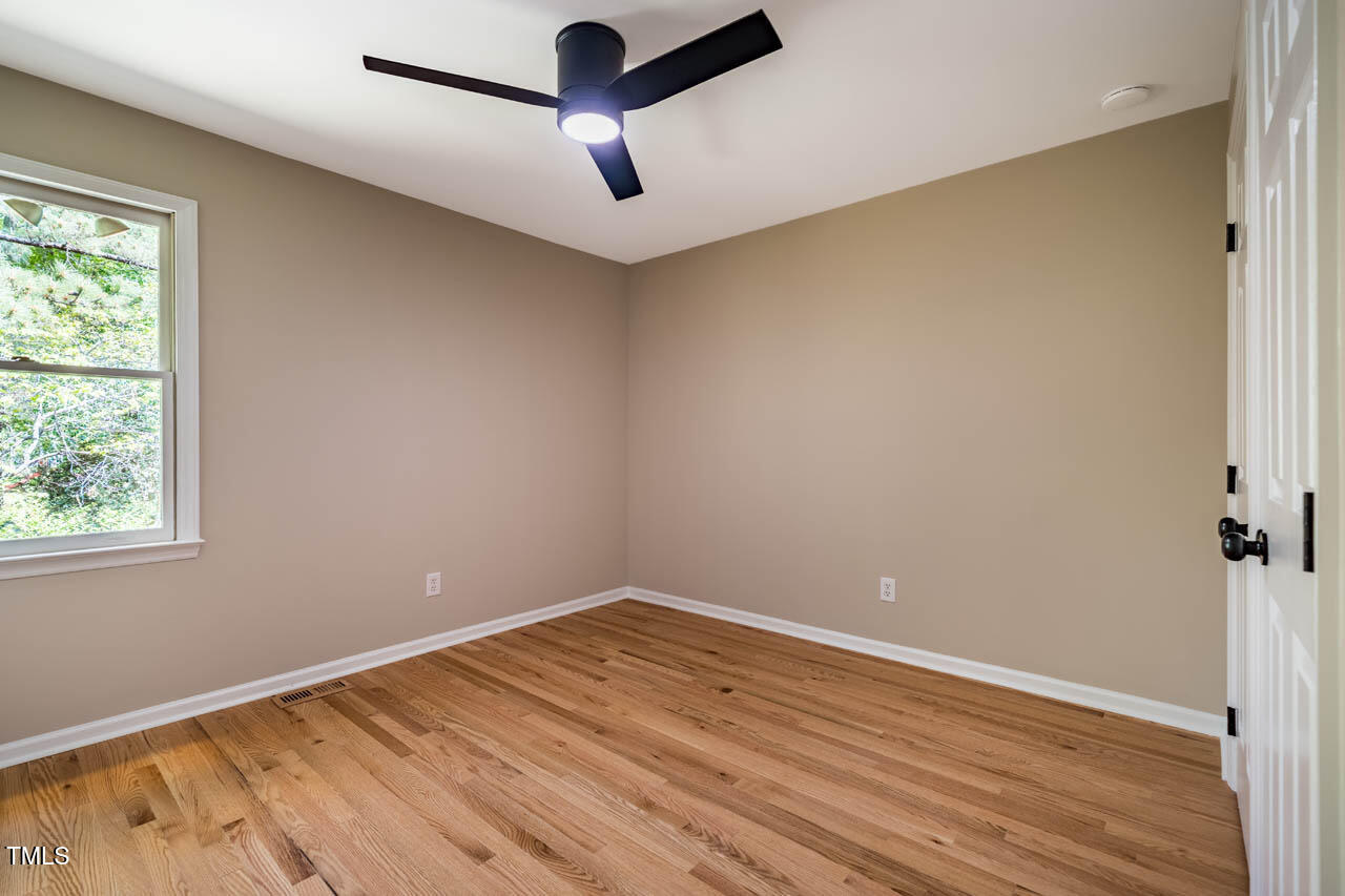 103 Windhover Drive Chapel Hill, NC 27514 - Photo 39 of 61 an empty room with a window