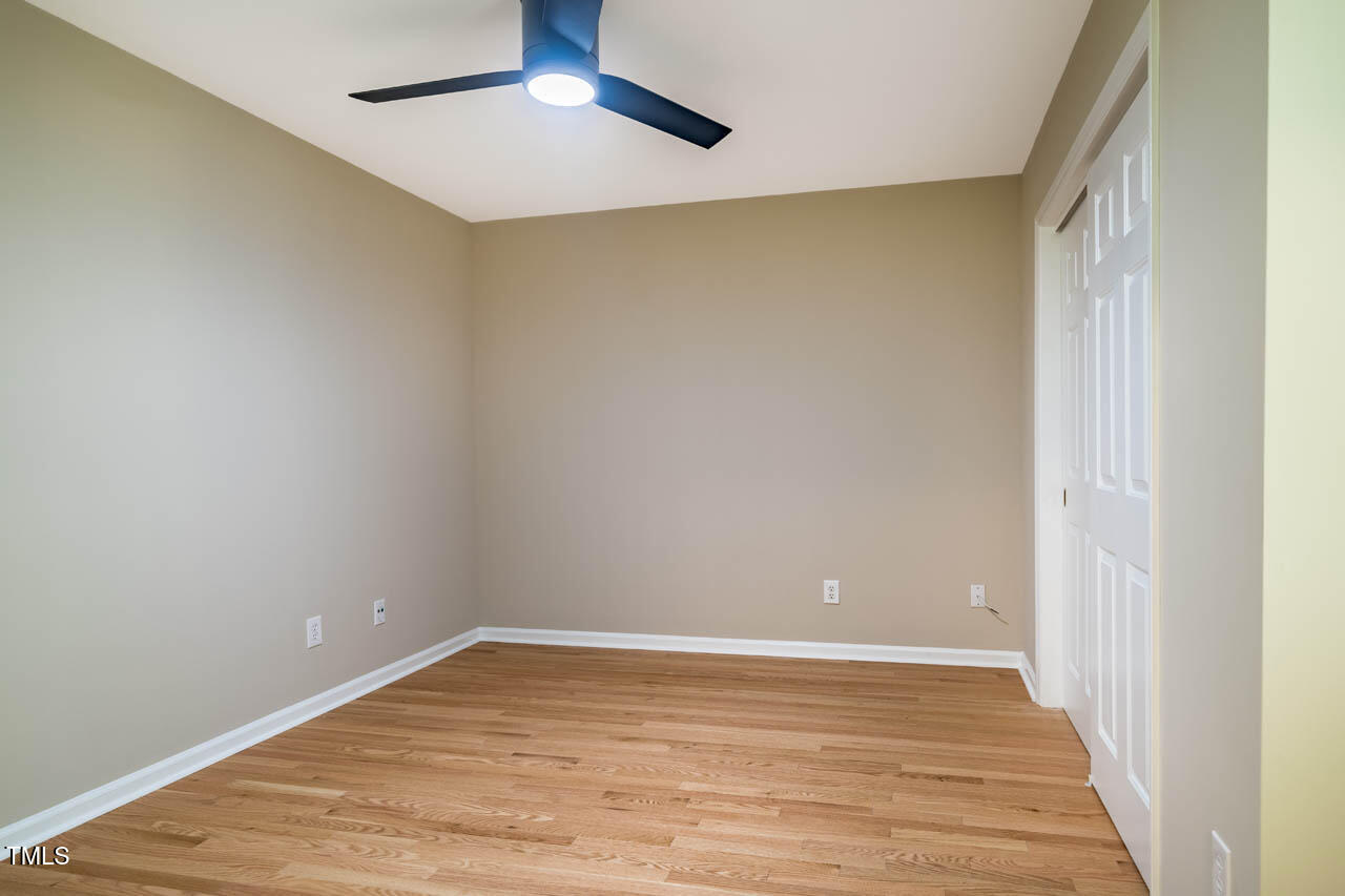 103 Windhover Drive Chapel Hill, NC 27514 - Photo 42 of 61 a view of an empty room with wooden floor