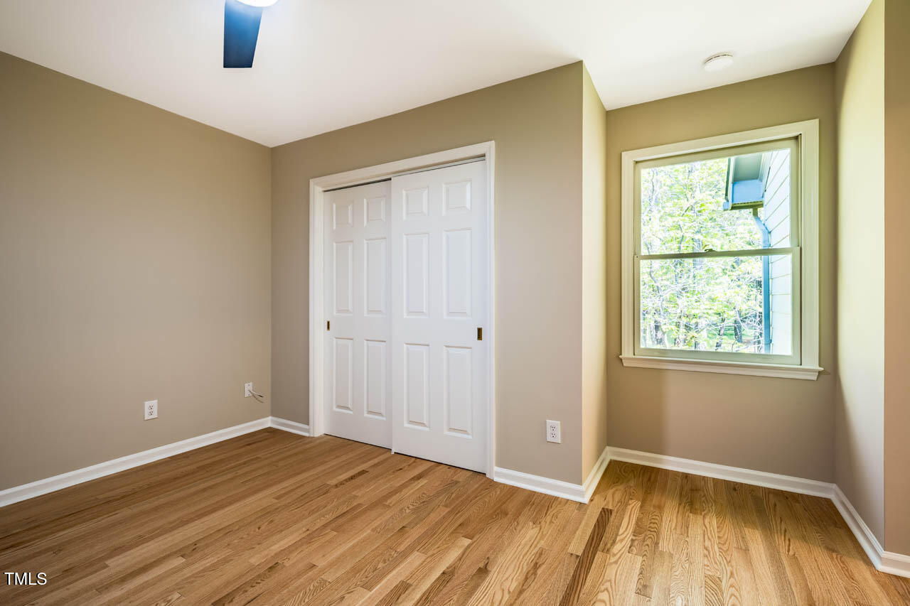 103 Windhover Drive Chapel Hill, NC 27514 - Photo 43 of 61 wooden floor in an empty room with a window