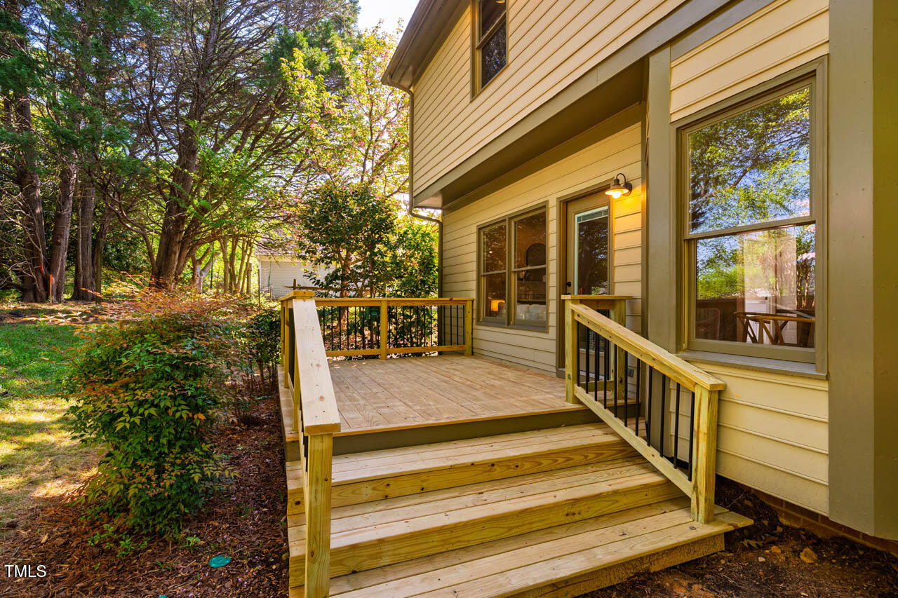 103 Windhover Drive Chapel Hill, NC 27514 - Photo 45 of 61 a view of a balcony with wooden floor and fence