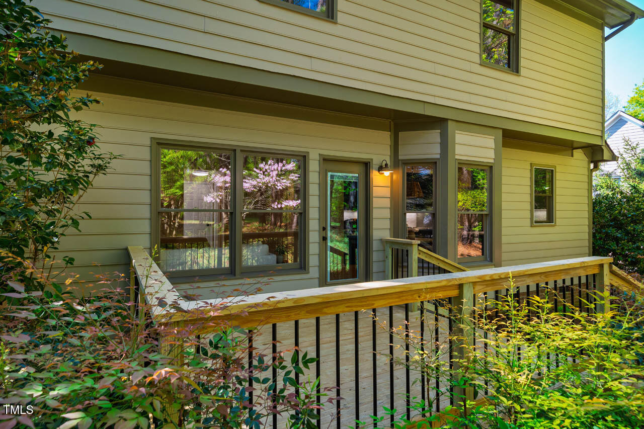103 Windhover Drive Chapel Hill, NC 27514 - Photo 47 of 61 a view of a porch with a bench