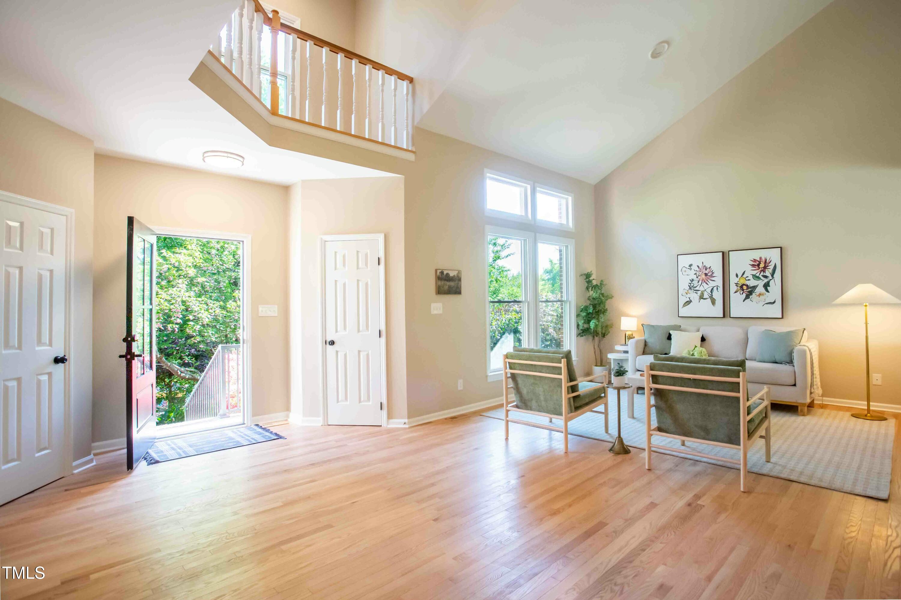 103 Windhover Drive Chapel Hill, NC 27514 - Photo 8 of 61 a view of a livingroom with furniture hardwood floor and workspace