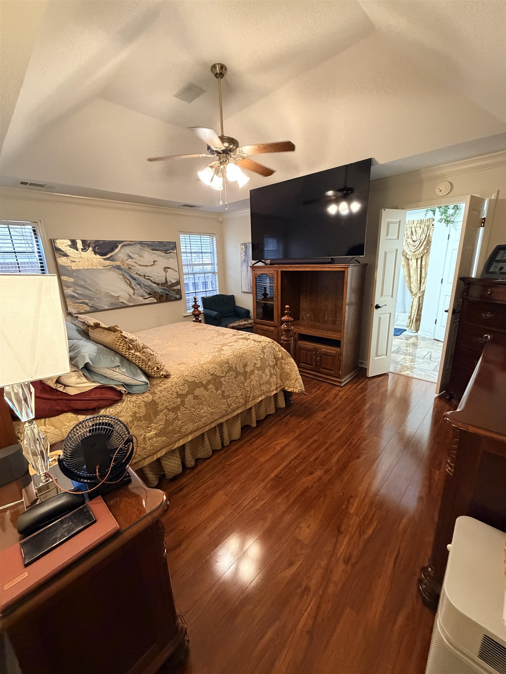 4680 Sun Ridge Drive Memphis, TN 38128 - Photo 10 of 16 Bedroom with a tray ceiling, dark wood finished floors, a ceiling fan, and ornamental molding