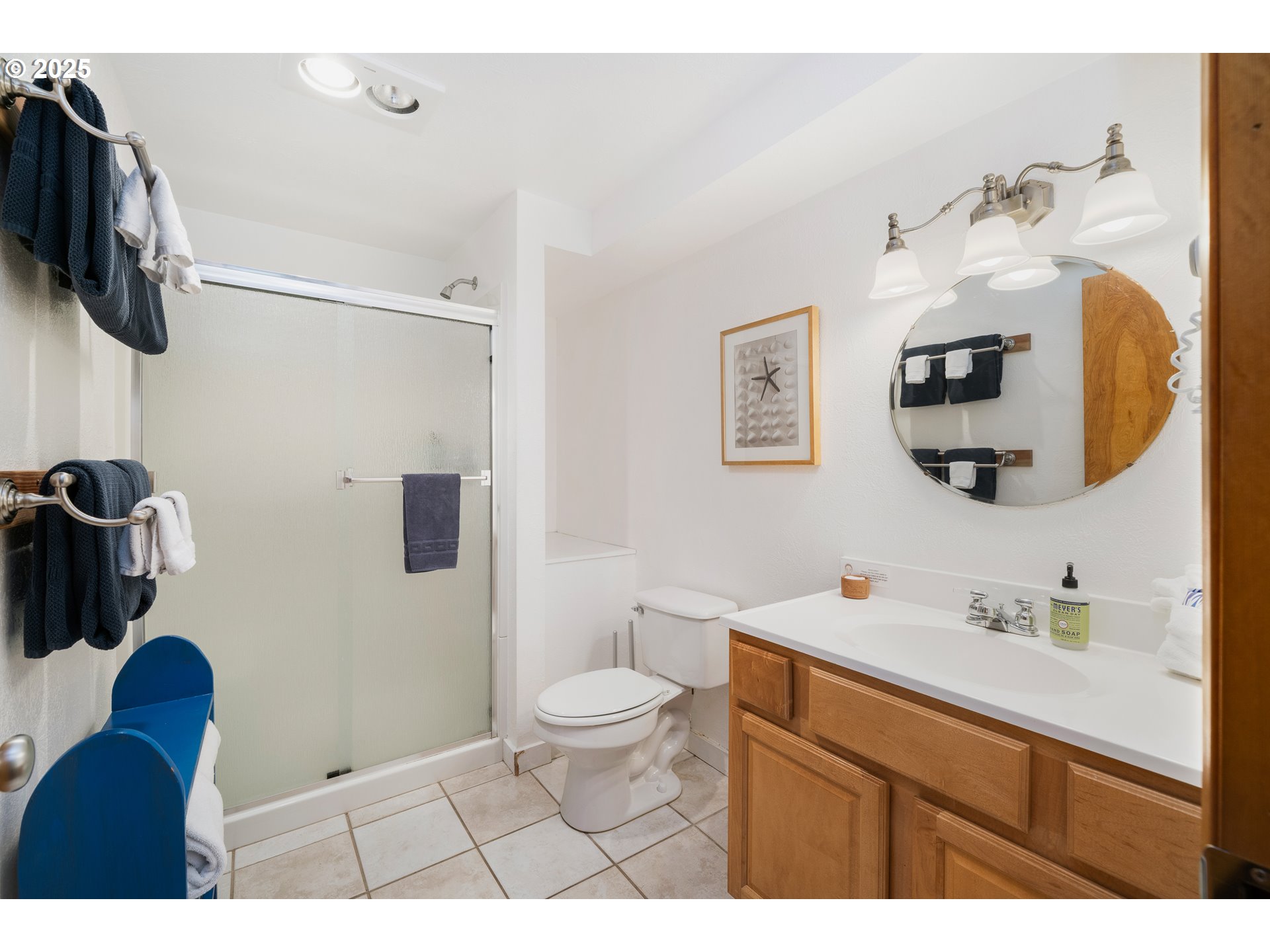 640 Ocean Road Manzanita, OR 97130 - Photo 18 of 47 a bathroom with a toilet sink and mirror