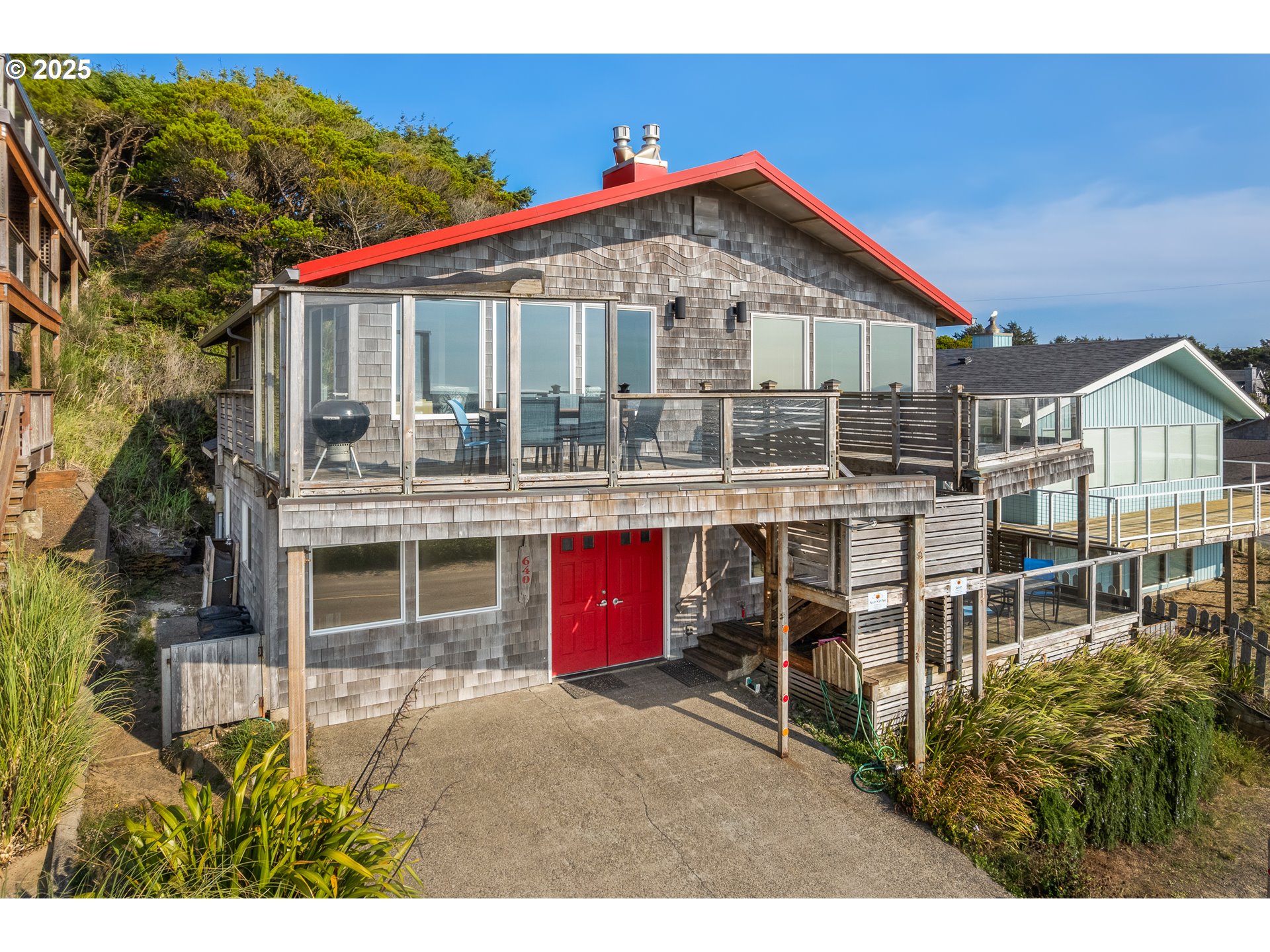640 Ocean Road Manzanita, OR 97130 - Photo 2 of 47 a front view of a house with a yard