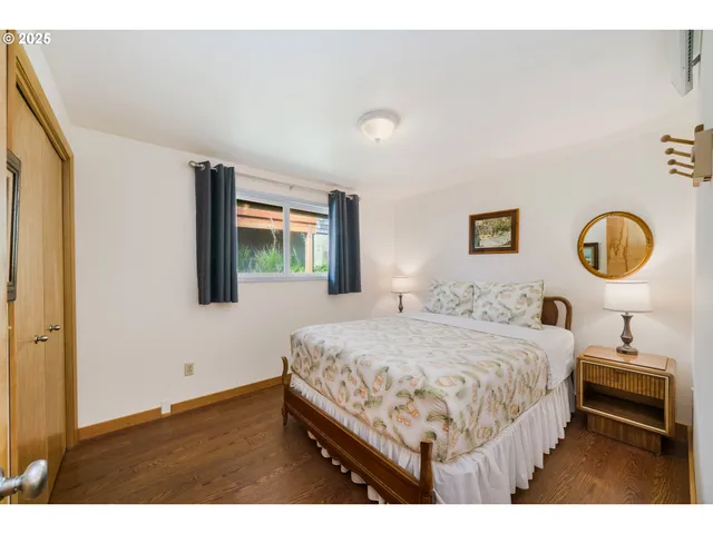 a bathroom with a sink toilet double vanity and mirror