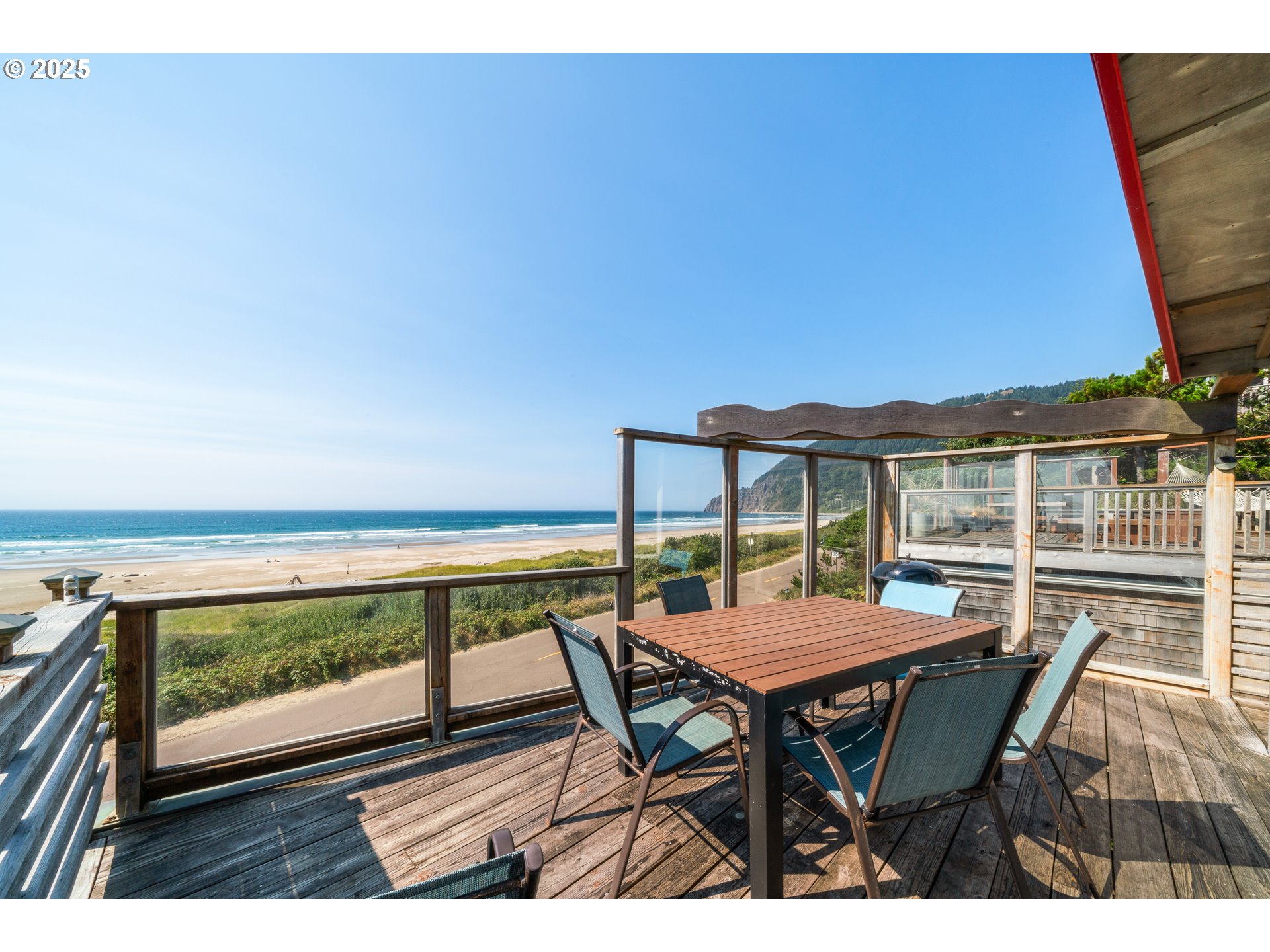 640 Ocean Road Manzanita, OR 97130 - Photo 3 of 47 a balcony with table and chairs