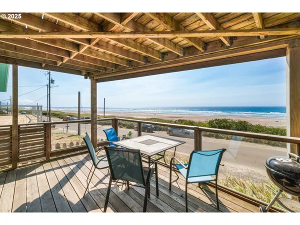 a view of a patio with wooden floor