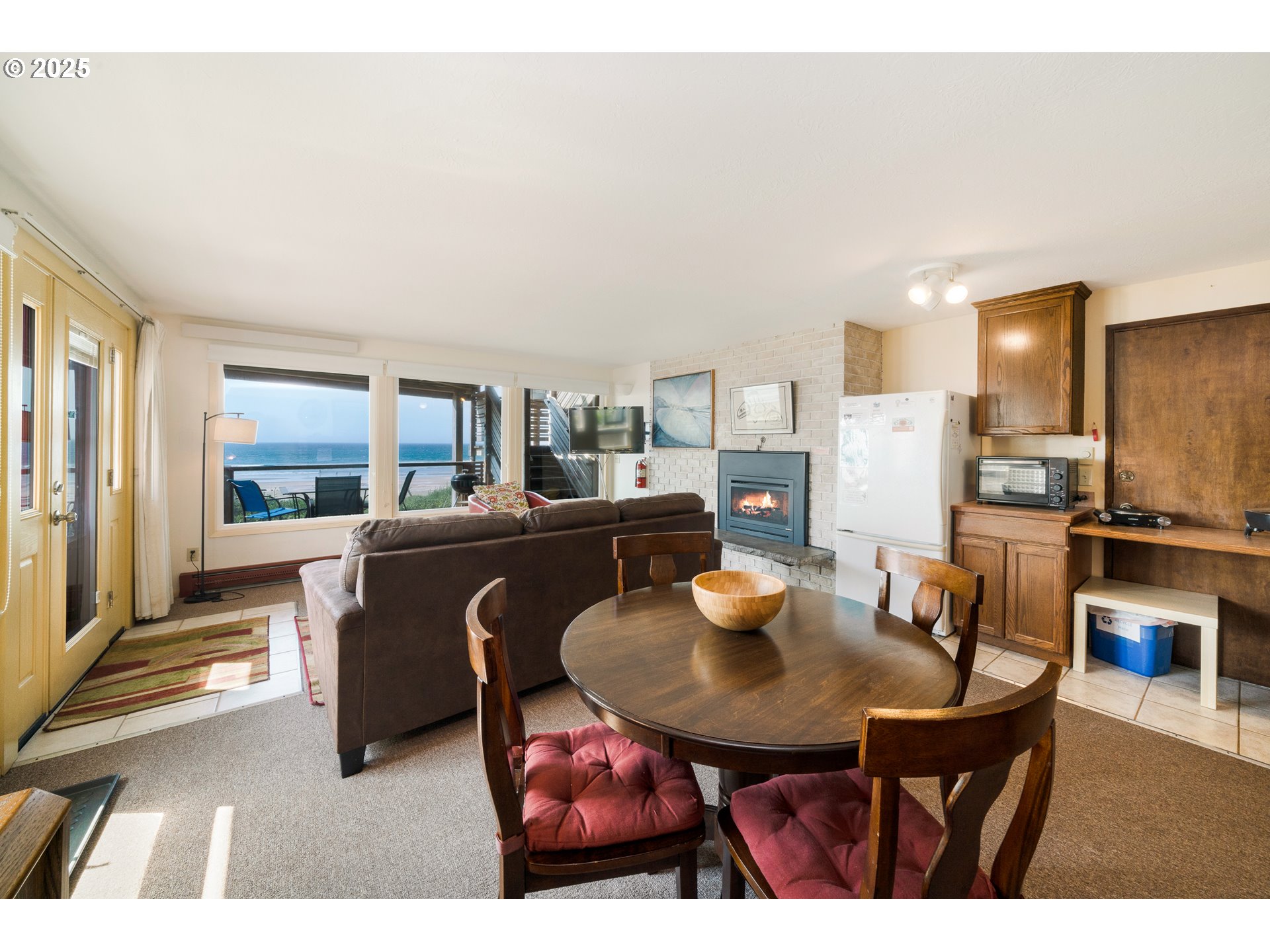 640 Ocean Road Manzanita, OR 97130 - Photo 38 of 47 a view of a dining room with furniture and a floor to ceiling window