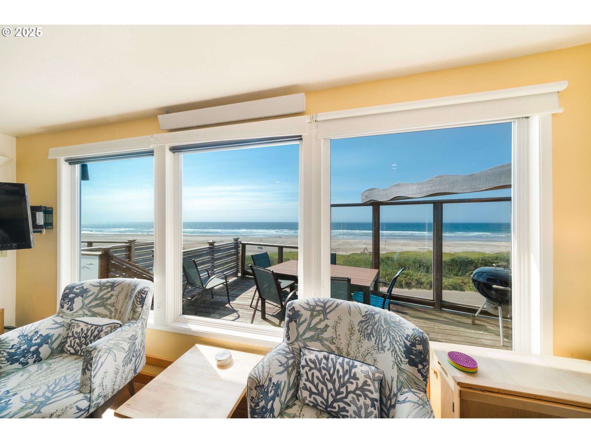 640 Ocean Road Manzanita, OR 97130 - Photo 6 of 47 a living room with furniture and a floor to ceiling window
