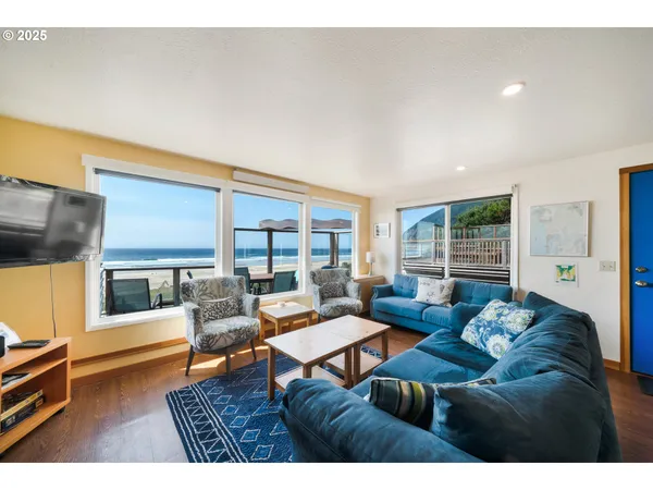 a living room with furniture and a large window