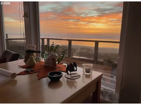 a table with chairs and a table with garden view