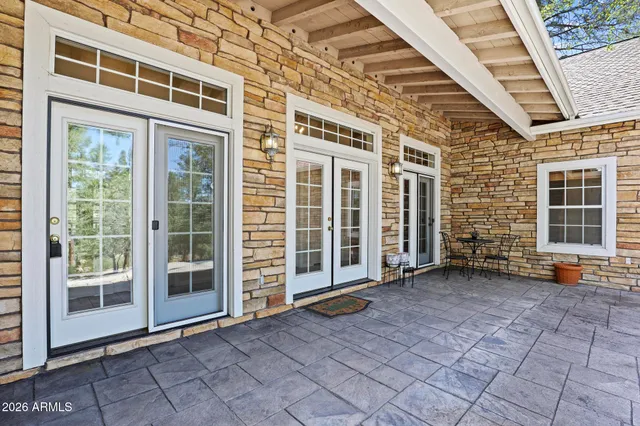 a view of a brick house with many windows