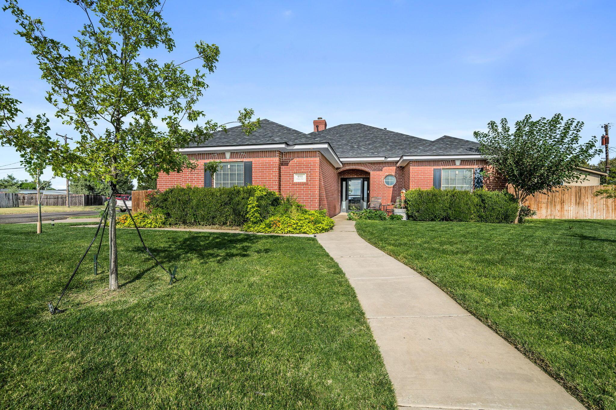 950 West Crane Road Pampa, TX 79065 - Photo 1 of 25 a view of house with a big yard and potted plants