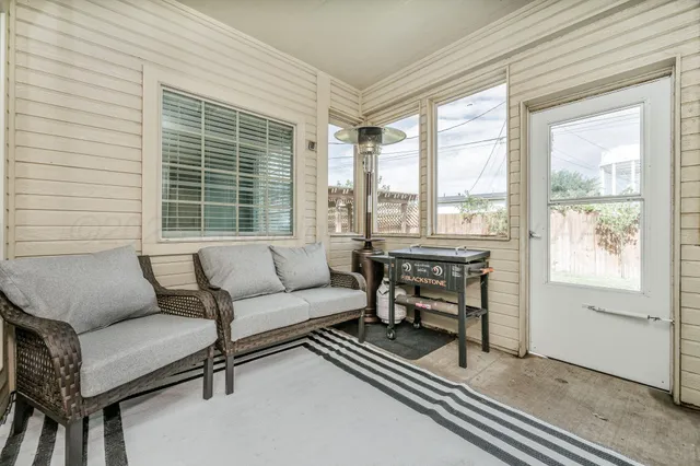 a living room with furniture and a window