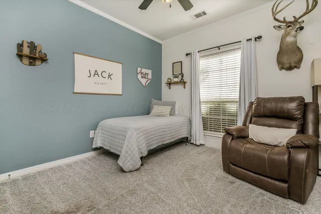 a bedroom with a bed and couch