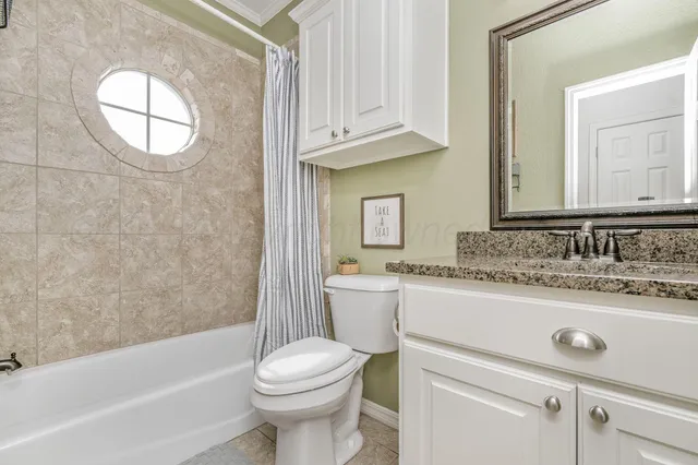 a bathroom with a sink a toilet and bathtub