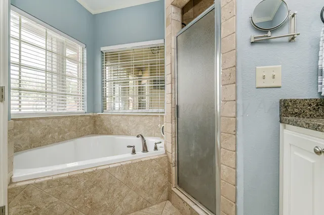 a white bath tub sitting next to a window