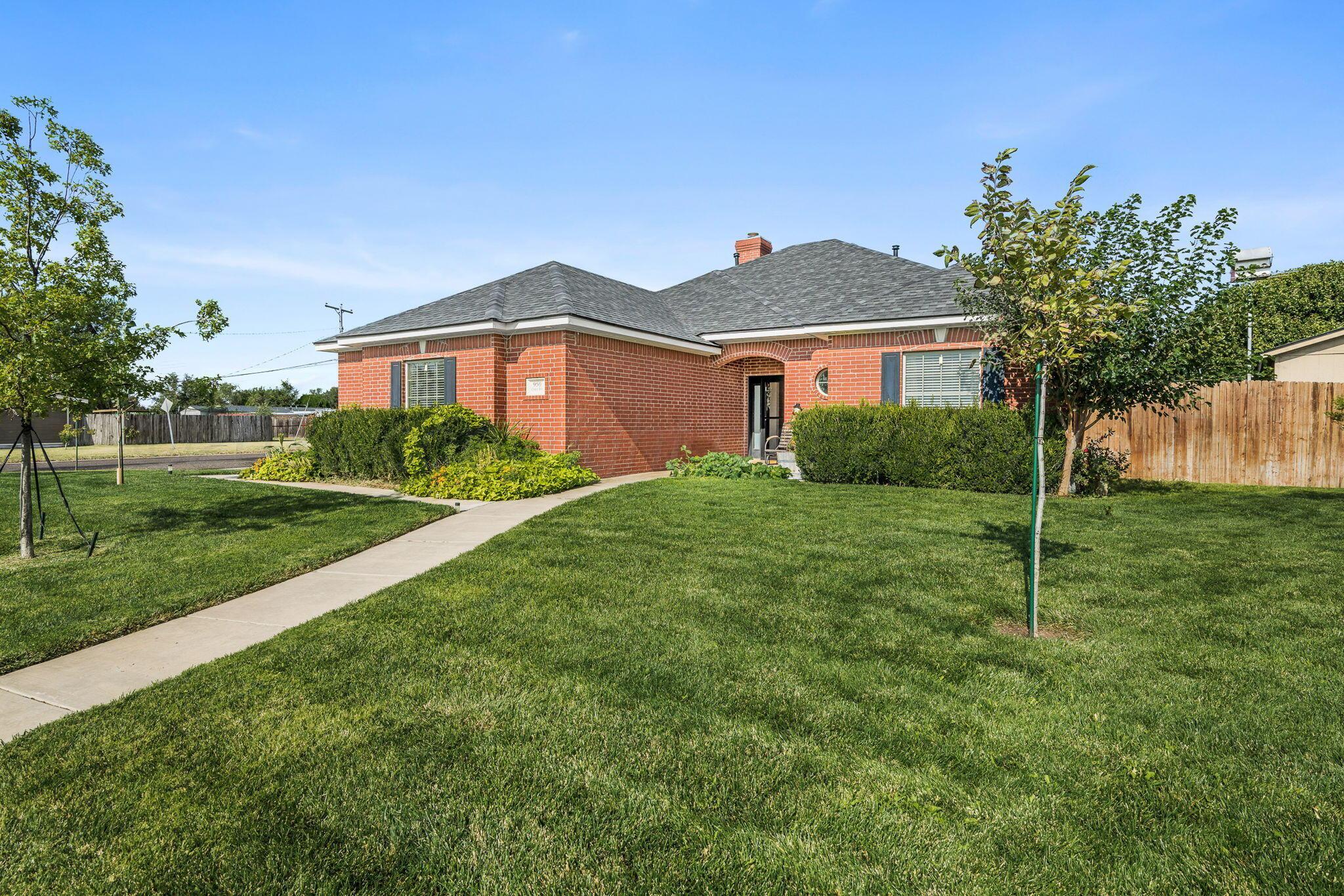 950 West Crane Road Pampa, TX 79065 - Photo 2 of 25 a view of a front of house with a yard