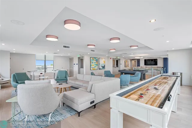 a living room with furniture and flat screen tv